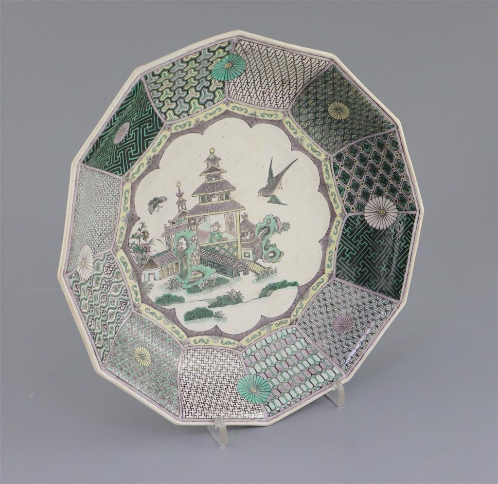 An unusual Chinese famille verte decorated biscuit porcelain twelve sided dish, 19th century in Kangxi style, 26cm wide